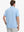 Rear half-body view of Modern Fit Melange Polo in LIGHT BLUE HEATHER, showing neat fit and fabric details.
