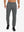 Front lower body view of model wearing soft sweatpants with 4 zipper pockets in black heather