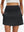 Front lower body shot of model wearing black women's stretch a-line golf skort with 7 pockets