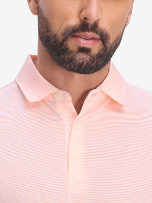 Front view from nose to chest of model wearing light pink white comfy breathable pin-stripe texture golf polos