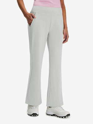 Front lower body shot of model wearing silver gray women's high waist stretch golf pants with pockets