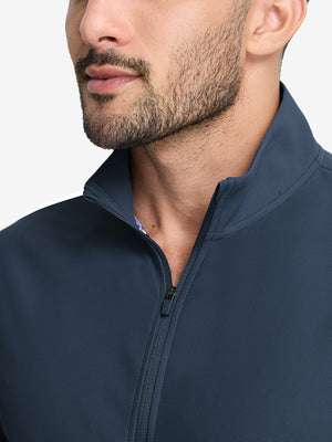 Front view from nose to chest of model wearing navy waffle texture 1/4 zip pullover