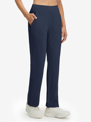 Front lower body shot of model wearing the navy women's lightweight high waisted golf pants, showcasing the fit
