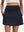 Front lower body shot of model wearing navy blue women's stretch a-line golf skort with 7 pockets