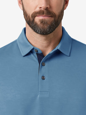 Front view from nose to chest of model wearing light blue  ultra-comfort slim fit roma knit polo shirts
