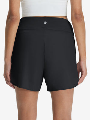 Back lower body shot of model wearing black women's gym golf shorts with liner pocket