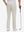 Back lower body shot of model wearing fossil straight fit lightweight dress golf pants