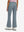 Back lower body shot of model wearing grey blue women's high waist stretch golf pants with pockets