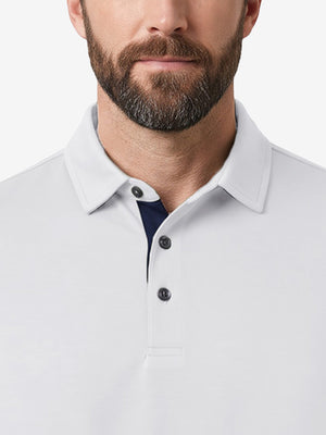 Front view from nose to chest of model wearing white  ultra-comfort slim fit roma knit polo shirts