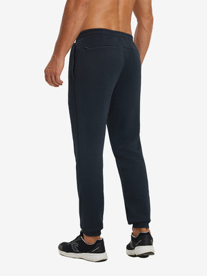 Back lower body view showing navy soft sweatpants with 4 zipper pockets