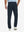 Back view of model wearing water-resistant golf stretch nylon pants, tailored stretch fit in navy.