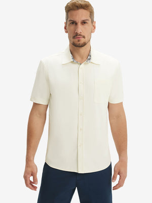 Front upper body shot of model wearing cream cool print plain button up shirts