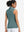 Back upper body shot of model wearing dusty blue women's athletic quarter zip tank tops