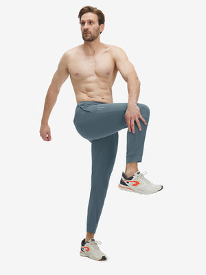Model wearing misty blue superion softness mesh joggers with zipper pockets in motion