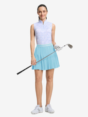 Front full body shot of model with golf gear wearing lake green women's moisture-wicking athletic tennis skirts