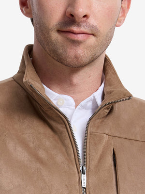 Front view from nose to chest of model wearing khaki classic micro suede leather puffer vest
