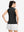 Back upper body shot of model wearing black women's moisture-wicking mock neck sleeveless golf tops