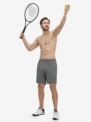 Front full body shot of model exercising in iron grey 4 way stretch breathable workout athletic shorts