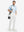 Front full body shot of model wearing white stretch cotton blend slim fit golf trousers 5 pockets