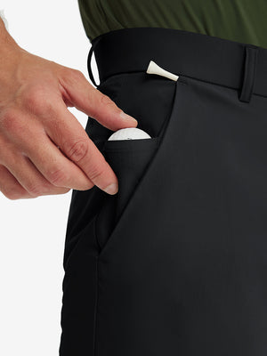 Detail shot of the side pocket on the black stretch soft flat front dress golf shorts, showing functionality