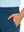 Close-up detail of one hand resting in pocket, showing relaxed fit of the blue indigo quick dry pants.