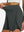 Detail view of elastic waistband on dark grey women's gym golf shorts with liner pocket