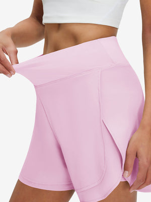 Detail view of elastic waistband on light pink women's gym golf shorts with liner pocket