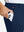 Close-up detail showing phone being placed in the pocket of navy water-resistant stretch heat-tech winter trousers
