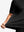 Side fabric stretch display in black of men's short sleeve slim fit roma knit t-shirt.