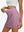Detail view of elastic waistband on lavender pink high waist built-in short a-line golf skirt with 5 pockets