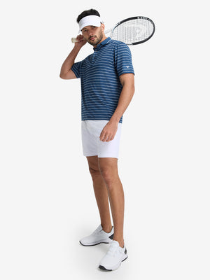 Front full body shot of model exercising in navy peony/arctic white non-curl ribbed collar striped polo shirts
