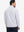 Back upper body angle of the brown grey camo full print quarter zip pullover, model turns head slightly.