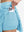 Detail view of inner pocket on lake green women's moisture-wicking athletic tennis skirts