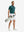 Full front: model in turquoise stripe upgraded two-tone striped quick dry polo shirt holding golf bag.