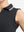 Detail view of armhole on black women's collared v neck quick dry tank tops