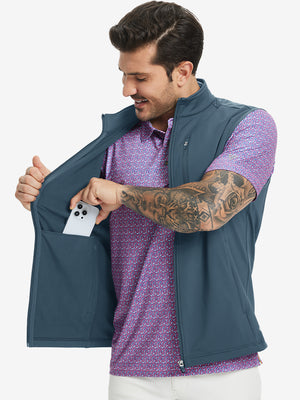 Close-up of water-resistant fleece golf vests pocket holding a phone, practical detail in bluish grey