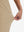 View showing loose fit of light khaki women's high waist stretch golf pants with pockets