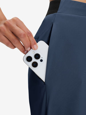 Side view of pocket on navy women's lightweight athletic sweatpants