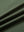 Close-up of olive green long sleeve solid jersey polo fabric texture showing soft knit and smooth finish details.