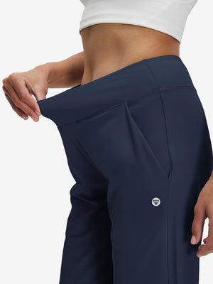 Detail view of the elastic waistband on the navy women's lightweight high waisted golf pants, highlighting comfort