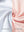 Close-up of the inner and outer fabric of youth full print stylish hoodies pullover in orange sea wave, showing texture and finish