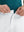 Detail view of the zipper on the white stretch soft flat front dress golf shorts, highlighting secure closure