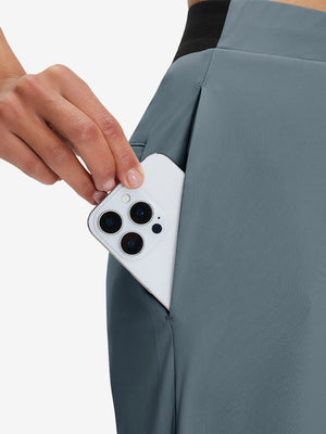 Side view of pocket on grey blue women's lightweight athletic sweatpants