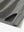 Detail of the side vent hem on the black feather weight jacquard polo shirts, showing the split design feature