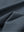 Close-up texture of dark grey waffle texture 1/4 zip pullover fabric showing detailed waffle knit material and weave.
