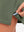 Hem stitching detail close-up in mossy stone of women's lightweight golf dress with 2 pockets.