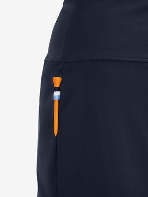 Side detail of navy high waist built-in short a-line golf skirt with 5 pockets