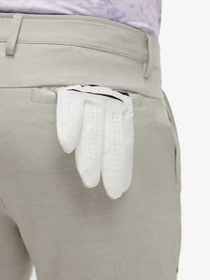 Detail view of back pocket on fossil straight fit lightweight dress golf pants