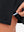 Hem stitching detail close-up in black of women's lightweight golf dress with 2 pockets