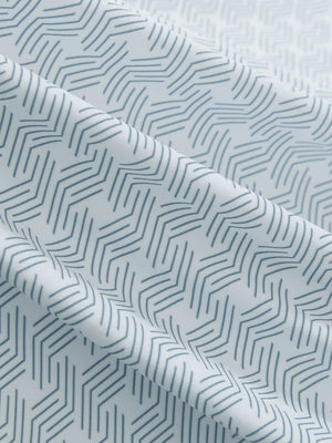 Close-up texture of dark grey line premium ribbed collar print polo shirts fabric showing detailed premium material and weave.